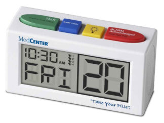A digital alarm clock, with the date, time and day of the week on a screen. The clock is white with four large coloured buttons on top.