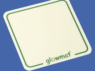 A luminous white coaster, with a green border and the branding for Glowmat at the bottom edge.