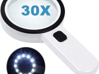 A white magnifying glass with a black push button on its handle and a black rim around the magnifier. The image has the text "30x" overlayed on the magnifier to indicate the strength of magnification and a smaller image of the product illuminated around the lens in a dark room over printed text.