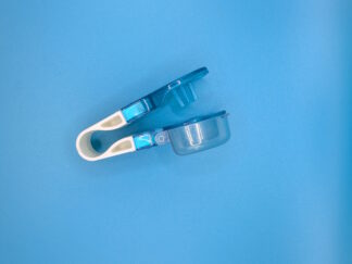 A small tool with a round cup and a flat spike attached with a press.