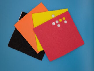 Four sheets of coloured sticker dots, in red, yellow, orange and black. Some sheets have dot stickers missing.